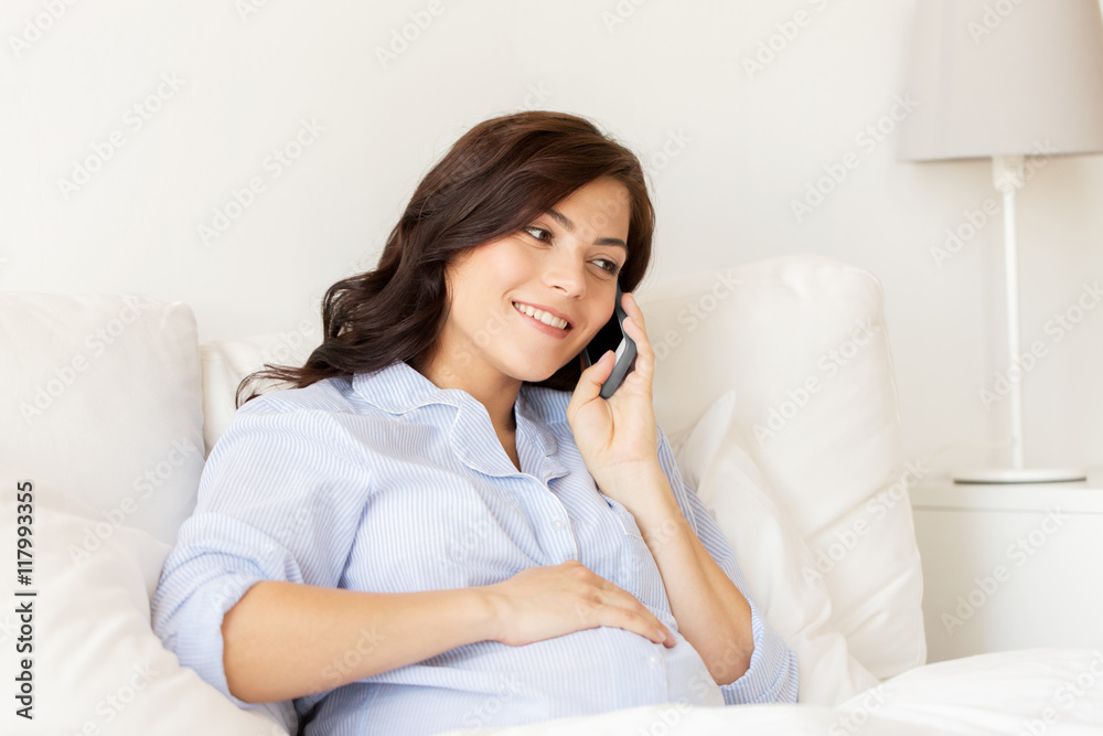 happy pregnant woman calling on smartphone at home happy pregnant woman calling on smartphone at home