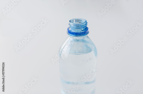 close up of bottle with drinking water on table