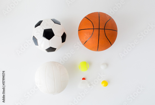 close up of different sports balls and shuttlecock
