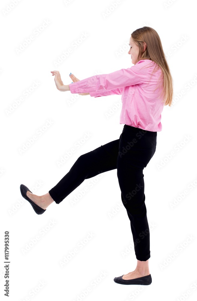 back view of business woman pushes wall. Isolated over white background. Rear view people collection. backside view of person. Woman office worker in a pink shirt repels someone hands and feet. back view of business woman pushes wall. Isolated over white background. Rear view people collection. backside view of person. Woman office worker in a pink shirt repels someone hands and feet.