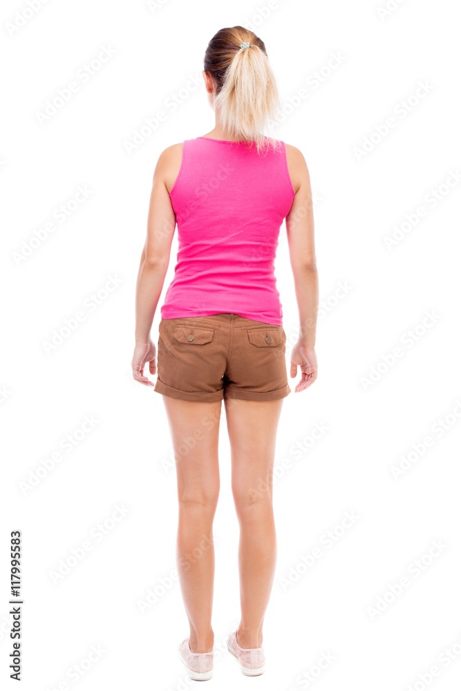 back view of standing young beautiful woman. girl watching. Rear view people collection. backside view of person. Isolated over white background. The girl in brown shorts and a pink shirt posing. back view of standing young beautiful woman. girl watching. Rear view people collection. backside view of person. Isolated over white background. The girl in brown shorts and a pink shirt posing.