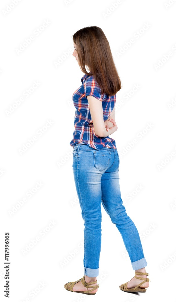 back view of standing young beautiful woman. girl watching. Rear view people collection. backside view of person. Isolated over white background. Girl in a blue plaid shirt with short sleeves is back view of standing young beautiful woman. girl watching. Rear view people collection. backside view of person. Isolated over white background. Girl in a blue plaid shirt with short sleeves is