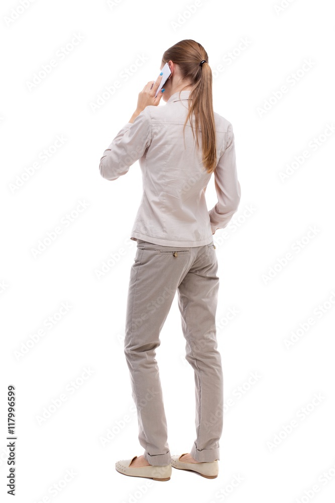 back view of a woman talking on the phone. backside view of person. Rear view people collection. Isolated over white background. A girl in a white jacket is white smartfonfon pressed to his ear. back view of a woman talking on the phone. backside view of person. Rear view people collection. Isolated over white background. A girl in a white jacket is white smartfonfon pressed to his ear.