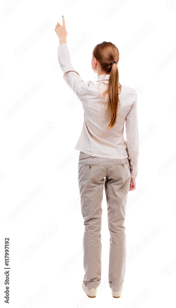 Back view of pointing woman. beautiful girl. Rear view people collection. backside view of person. Isolated over white background. A girl standing in a light suit and jeans showing thumbs up. Back view of pointing woman. beautiful girl. Rear view people collection. backside view of person. Isolated over white background. A girl standing in a light suit and jeans showing thumbs up.