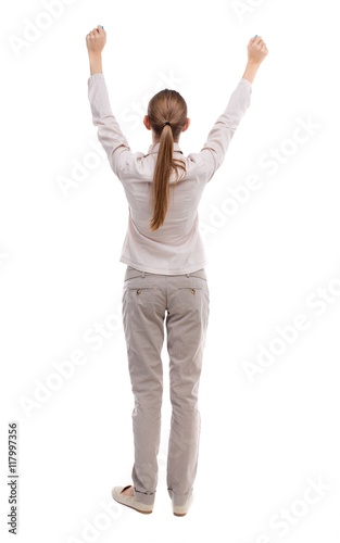 Back view of business woman. Raised his fist up in victory sign. Raised his fist up in victory sign. Rear view people collection. backside view of person. Isolated over white background. Girl