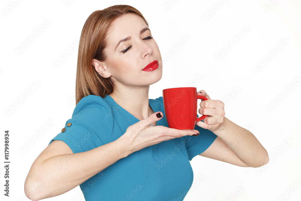 Young pretty woman holding a cup of tea or coffee Young pretty woman holding a cup of tea or coffee