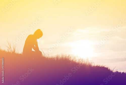 silhouette woman knee down with her hands