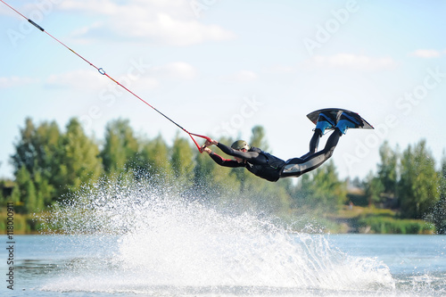 Man does wakeboarding sport.
