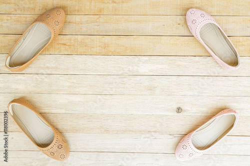 Female shoes on wood background