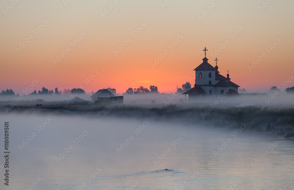 Early morning in small Ukraine village with orthodox church