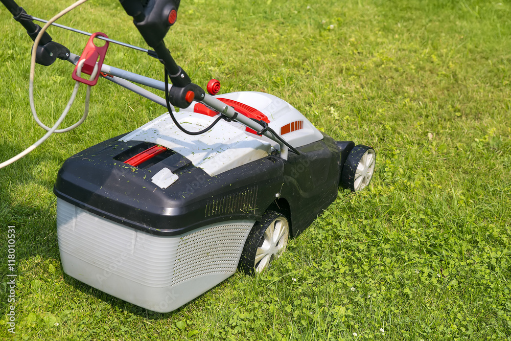 lawn-mower electric on green grass lawn-mower electric on green grass