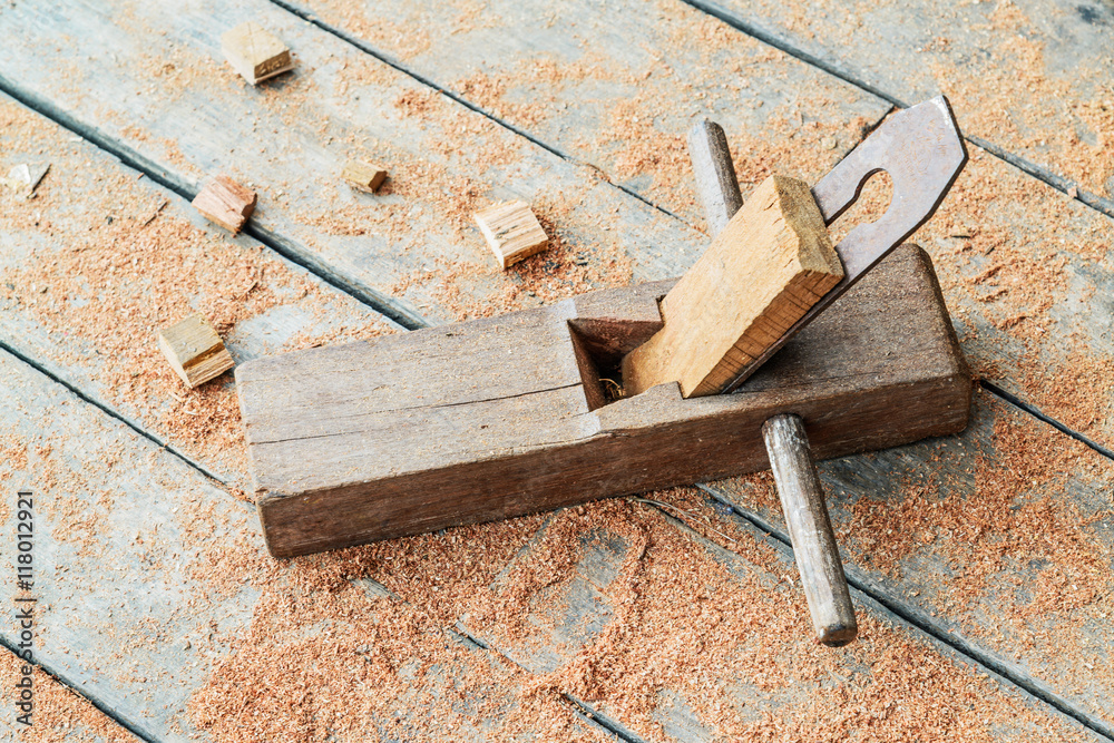 Old wooden carpenter hand plane on wooden. Old wooden carpenter hand plane on wooden.