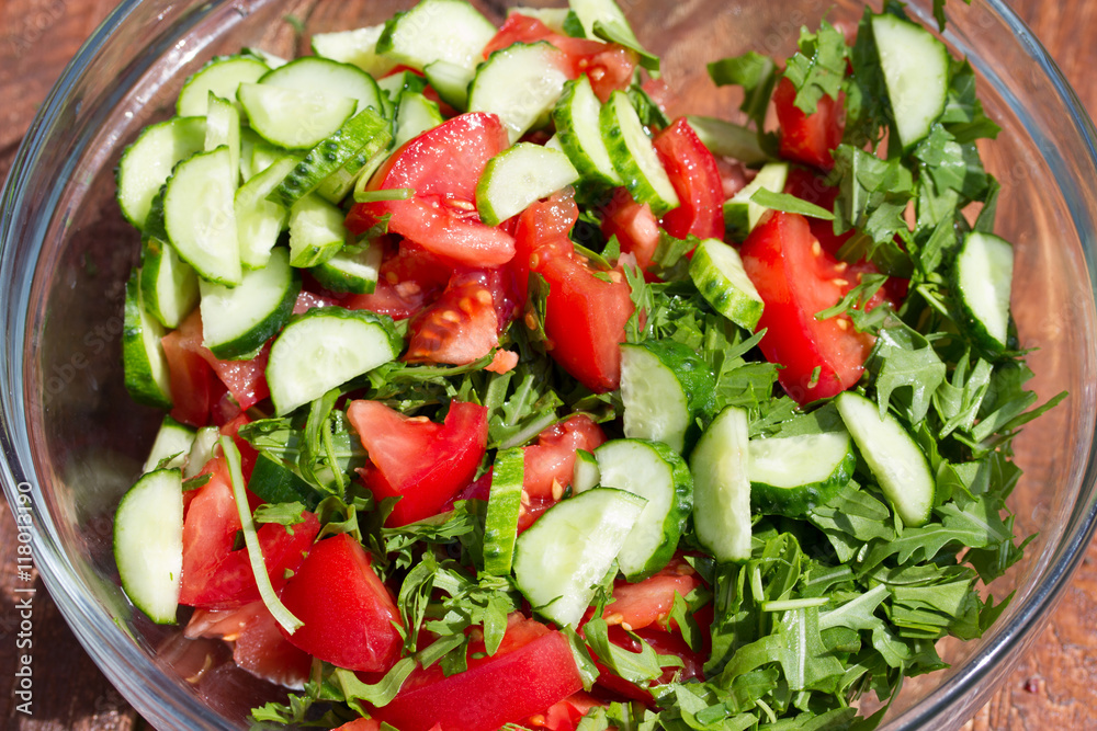 fresh vegetable salad in a plate on a wooden table fresh vegetable salad in a plate on a wooden table