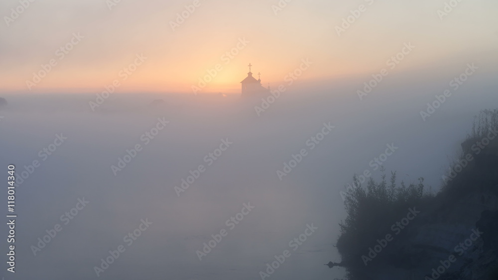 sunrise on the river near the church