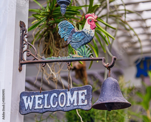 Doorbell welcome to home, Old cock symbol bell for ring and welc photo