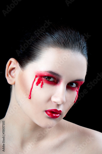 Beautiful girl with tears of blood