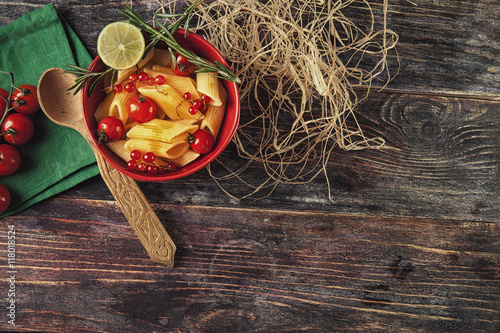 Italian pasta with soy sauce and stewed tomatoes, served in smal photo