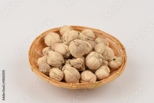 Siam Cardamom, Best Cardamom, Clustered Cardamom, Camphor Seed (Amomum krervanh Pierre)., The medicinal properties of spices in the basket on a white background photo