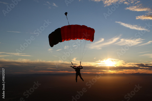 Skydiver in sunset
