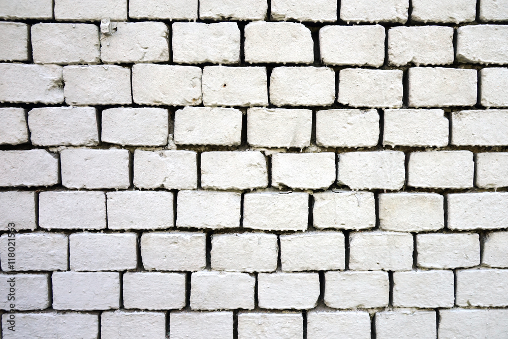 Old wall of bricks painted white. Old wall of bricks painted white.
