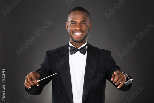 Portrait Of Music Conductor With Baton