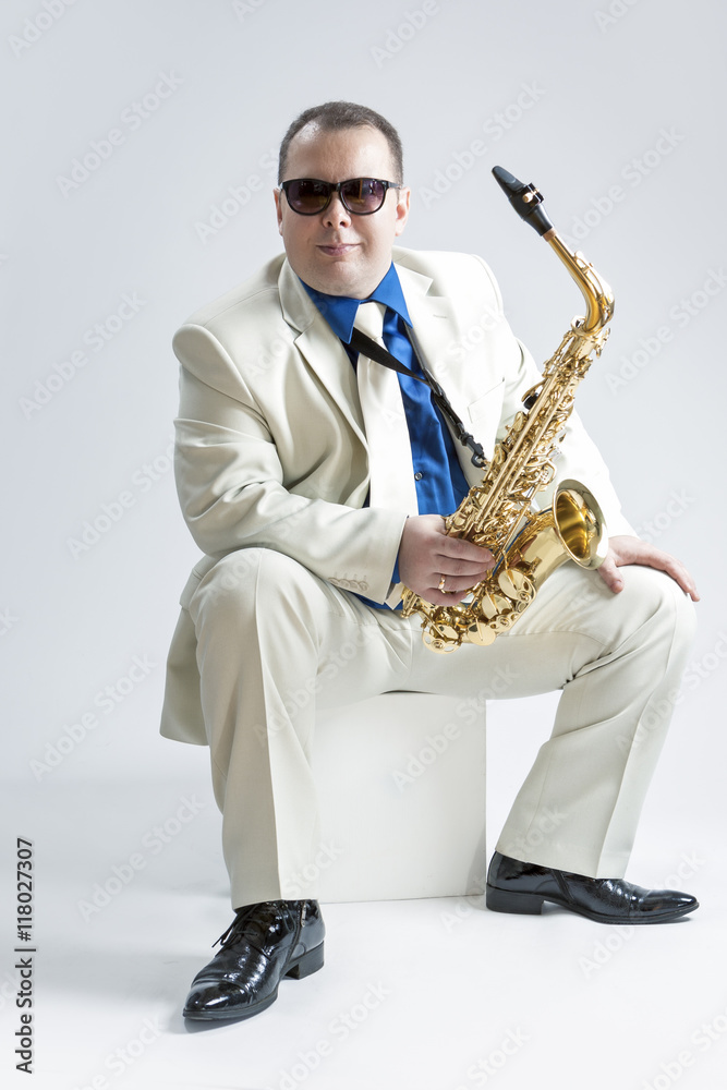 Fototapeta premium Music Concepts and Ideas. Portrait of Male Stylish Saxophone Player