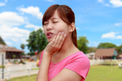Woman hands touching her own cheek or having toothache - dental