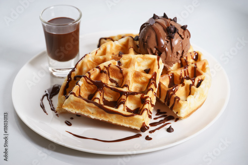 waffles with chocolate ice cream and chocolate sauce