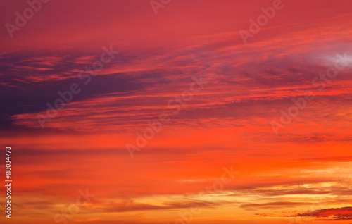 Beautiful fiery orange and red apocalyptic sunset sky. © es0lex