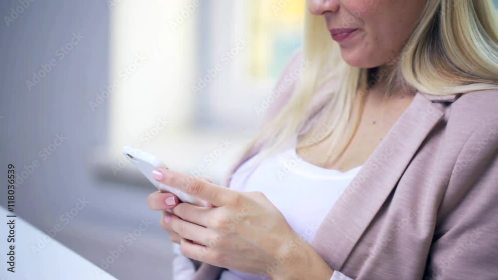 smiling woman or student texting on smartphone smiling woman or student texting on smartphone