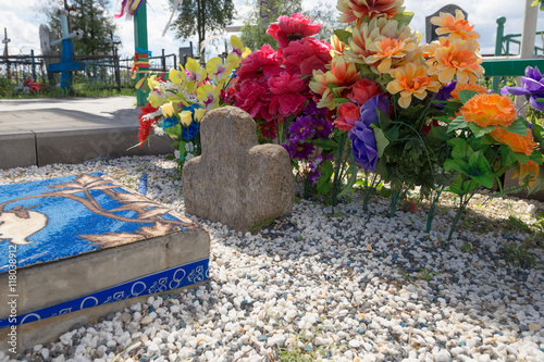 Turov, Belarus - August 7, 2016: place of worship pilgrims growing stone cross in a cemetery in the town of Turov, Belarus.