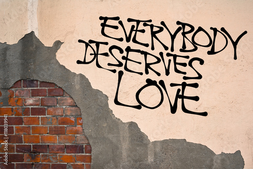 Everybody deserves love - Handwritten graffiti on the wall, anarchist aesthetics. Unconditional love between mates, friends, partners, family members. Loving despite imperfections
