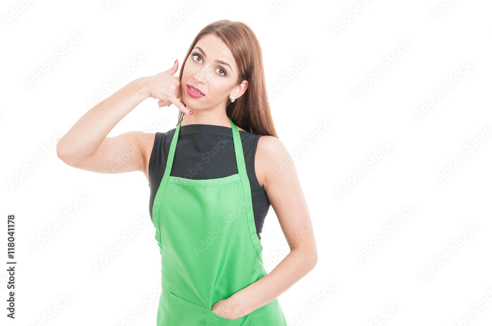 Attractive female seller doing a call gesture Attractive female seller doing a call gesture