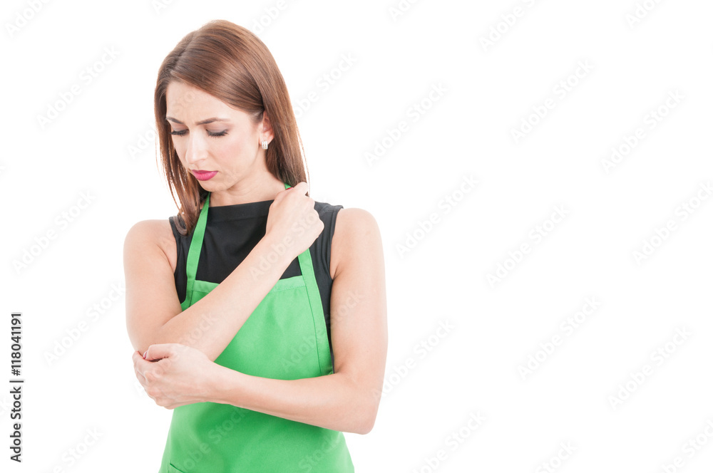 Pretty supermarlet seller with elbow pain Pretty supermarlet seller with elbow pain