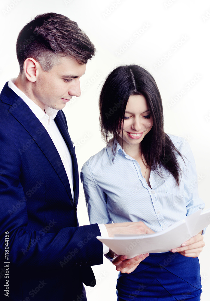 Image of business partners discussing documents and ideas at meeting. Work process of business meeting with electronic devices in office. Image of business partners discussing documents and ideas at meeting. Work process of business meeting with electronic devices in office.