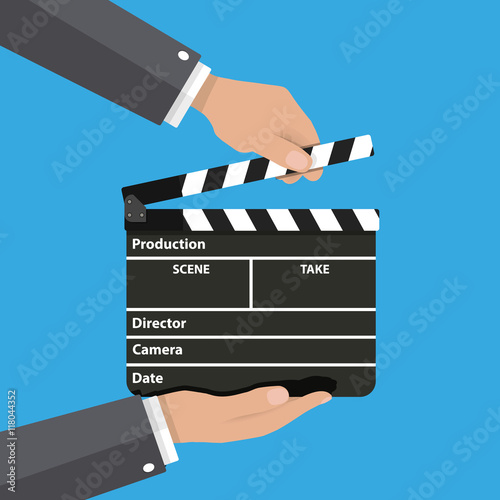 Black opened clapperboard in hands.