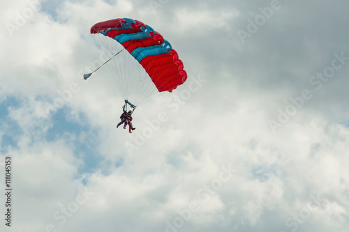 Tandem skydiving on a large parachute.