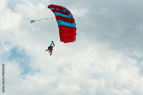 Tandem skydiving on a large parachute.