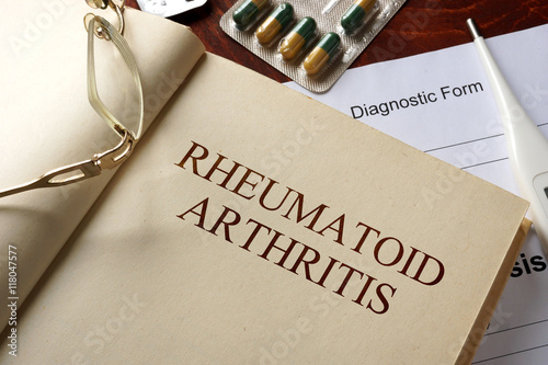 Book with diagnosis rheumatoid arthritis. Medic concept.