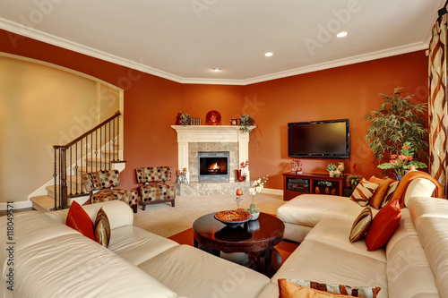 REd typical American family room with large sofa set.