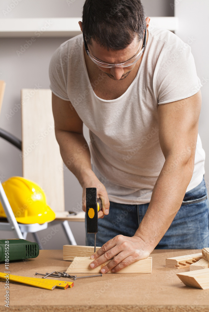 Carpenter working on a project Carpenter working on a project