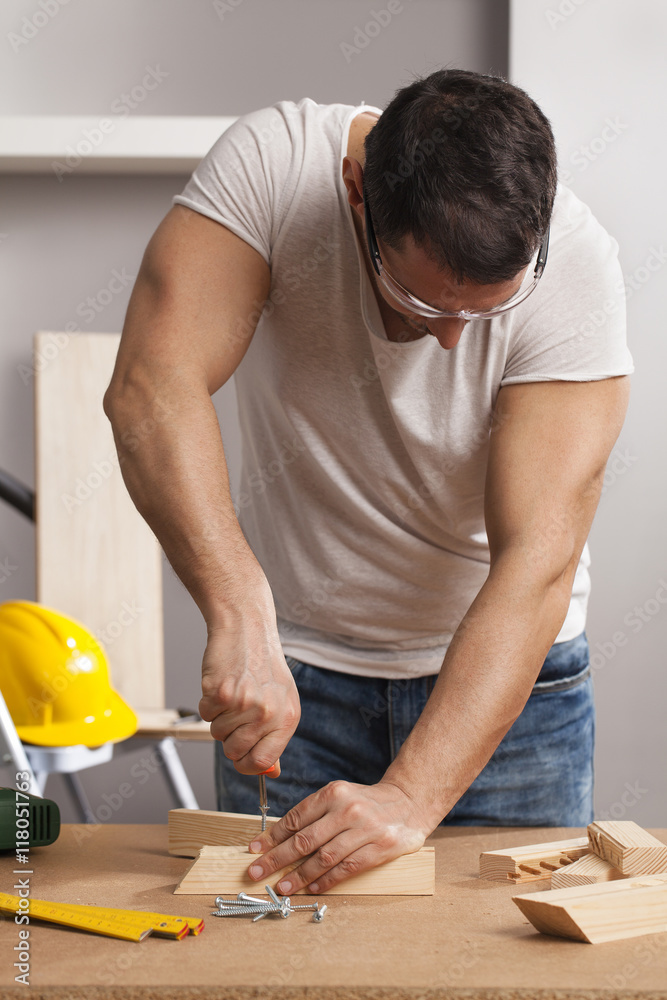 Carpenter working on a project Carpenter working on a project