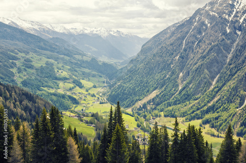 Beautiful view of Alps mountains. Spring in National Park Hohe Tauern  Austria. Green valley and snowy mountains peaks. Grossglockner high alpine road.