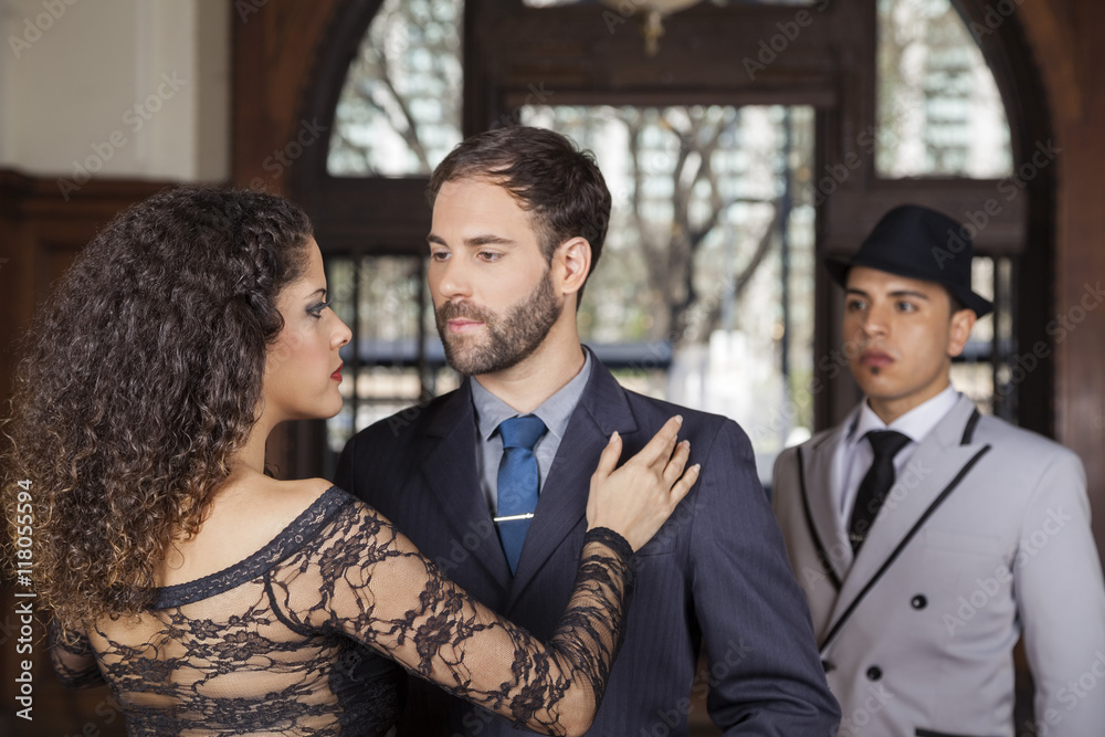 Man And Woman Performing Tango By Young Partner Man And Woman Performing Tango By Young Partner