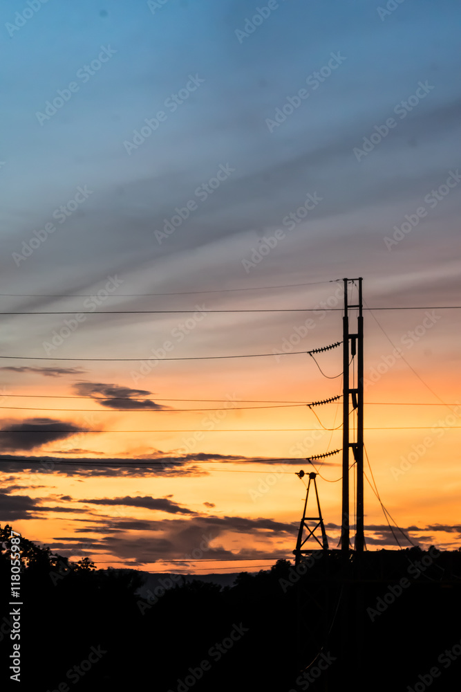 Silhouette of Electric Power Lines and High power transmission line at sunset