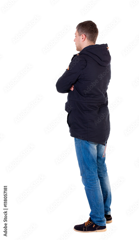 Back view of handsome man in winter jacket looking up. Standing young guy in parka. Rear view people collection. backside view of person. Isolated over white background. Man in warm jacket is Back view of handsome man in winter jacket looking up. Standing young guy in parka. Rear view people collection. backside view of person. Isolated over white background. Man in warm jacket is