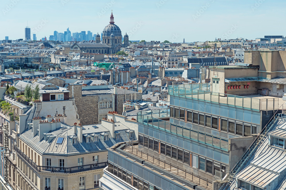 Paris rooftops. Beautiful view of the rooftops of Paris on a sunny day. Traditional parisian architecture, buildings with mansards and roofs
