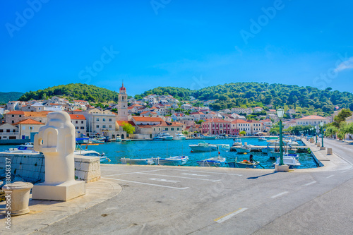 Pucisca town bay. / View at promenade and cityscape in Pucisca, Island of Brac, Croatia. photo