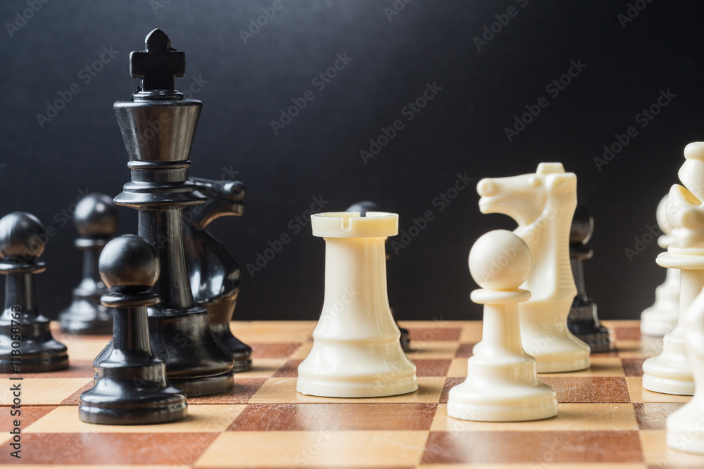 Chess pieces set on a chessboard Chess pieces set on a chessboard
