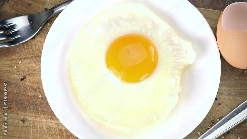 Fried Eggs (rotating, close-up) as not loopable 4K UHD footage Fried Eggs (rotating, close-up) as not loopable 4K UHD footage